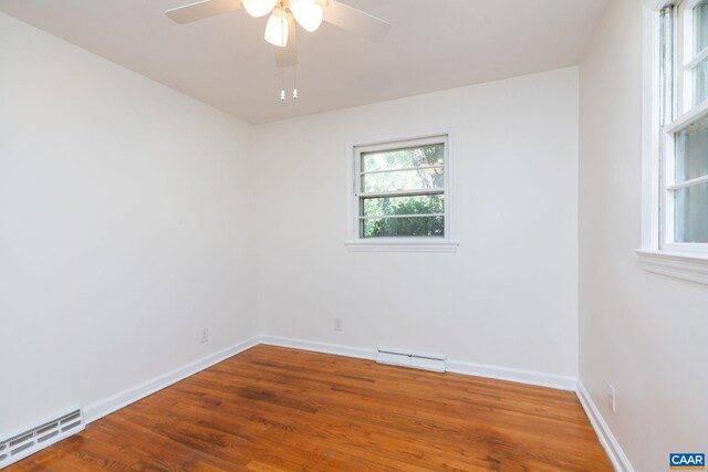 122 Westerly Ave, Charlottesville, VA 22903 - unfurnished room featuring wood finished floors, a baseboard radiator, a ceiling fan, and a baseboard heating unit