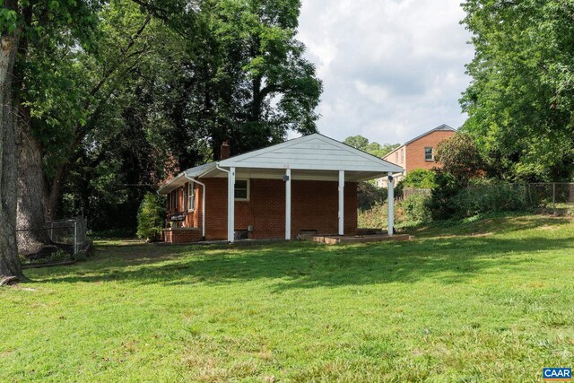 122 Westerly Ave, Charlottesville, VA 22903 - back of property with brick siding, a chimney, and covered porch