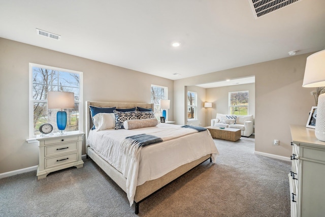 bedroom with carpet flooring, multiple windows, baseboards, and recessed lighting