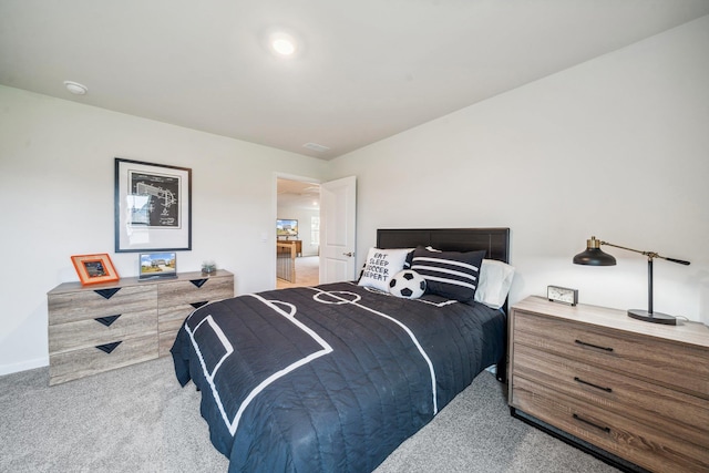 carpeted bedroom with baseboards