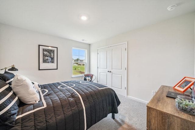 carpeted bedroom with baseboards