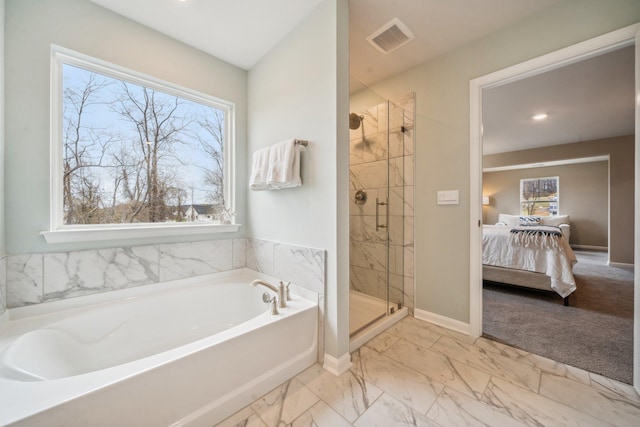 full bath featuring a garden tub, a shower stall, ensuite bathroom, marble finish flooring, and baseboards