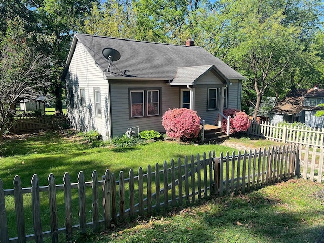 bungalow-style home featuring a chimney