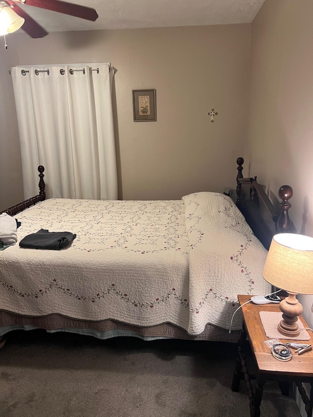 bedroom featuring carpet and a ceiling fan