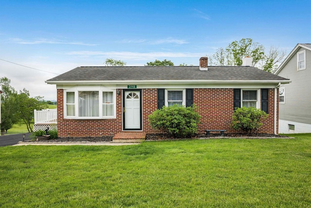 390 Frontier Dr, Staunton, VA 24401 - view of front facade featuring brick siding, a front yard, and a chimney