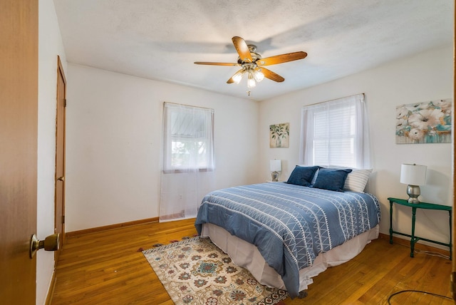 390 Frontier Dr, Staunton, VA 24401 - bedroom with wood finished floors, baseboards, and a ceiling fan
