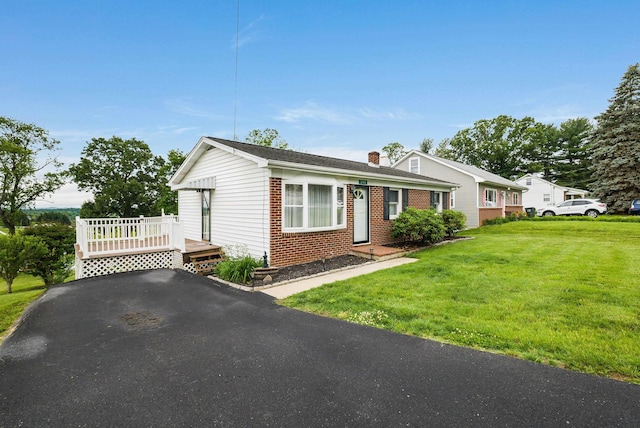 390 Frontier Dr, Staunton, VA 24401 - view of front of property with brick siding, a front lawn, a chimney, and a deck