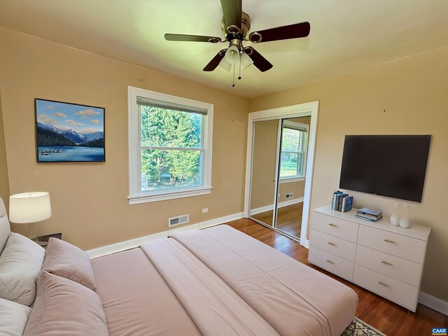 405 Moseley Dr, Charlottesville, VA 22903 - bedroom featuring baseboards, dark wood finished floors, ceiling fan, and a closet