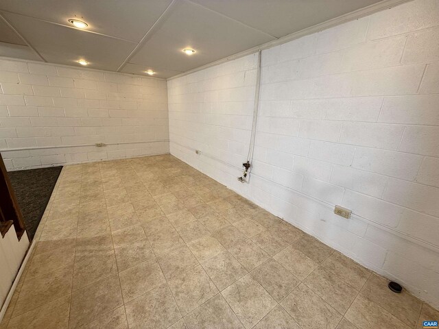 405 Moseley Dr, Charlottesville, VA 22903 - finished below grade area with tile patterned floors and concrete block wall
