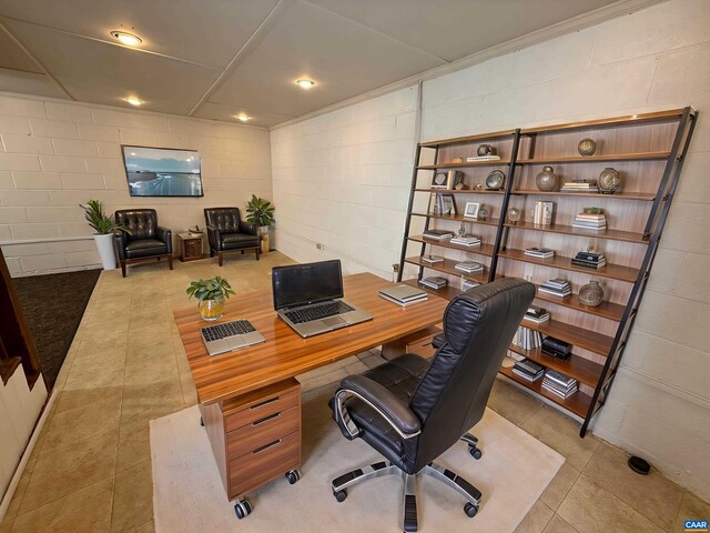 405 Moseley Dr, Charlottesville, VA 22903 - office area featuring concrete block wall and light tile patterned floors