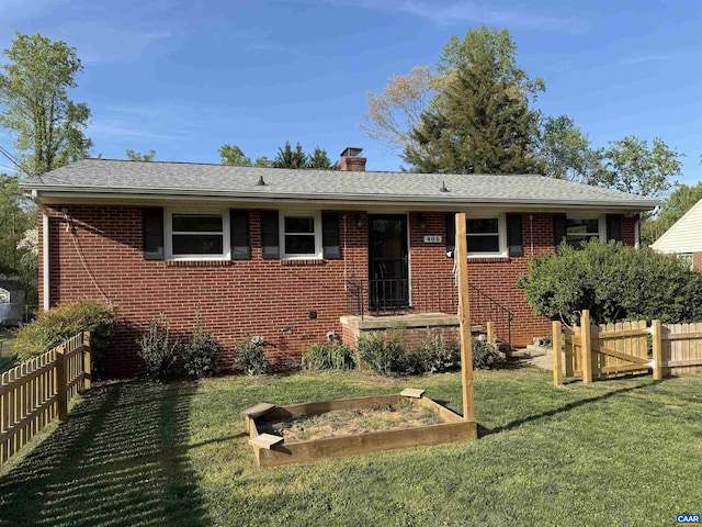 405 Moseley Dr, Charlottesville, VA 22903 - view of front of home with brick siding, a chimney, a garden, and a shingled roof