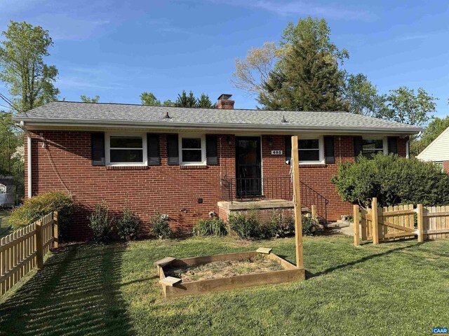 405 Moseley Dr, Charlottesville, VA 22903 - view of front of home with brick siding, a chimney, a garden, and a shingled roof