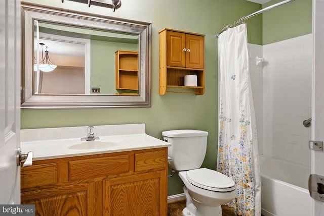 full bath with toilet, vanity, and shower / bath combo