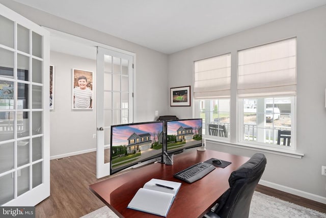 home office with wood finished floors, baseboards, and french doors