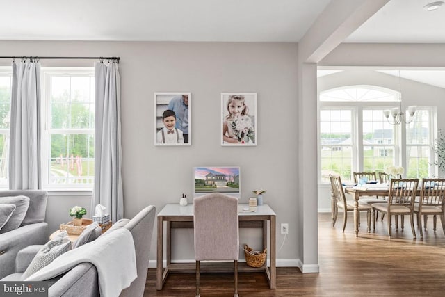 office area with a chandelier, dark wood-style floors, plenty of natural light, and baseboards