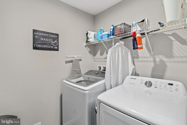 laundry area with independent washer and dryer