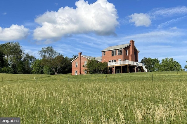 3542 Slate Mills Rd, Sperryville, VA 22740 - rear view of property featuring a chimney, a deck, and brick siding