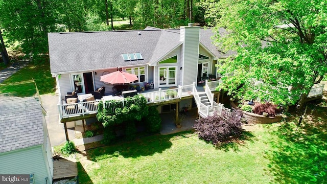 778 Overton Dr, Mineral, VA 23117 - rear view of property with a deck, a shingled roof, a yard, and a chimney