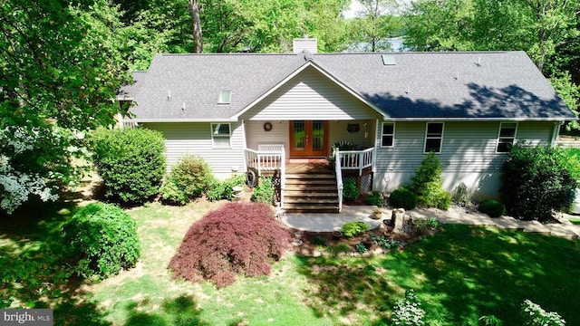 778 Overton Dr, Mineral, VA 23117 - single story home with a chimney, a front lawn, french doors, stairs, and a shingled roof