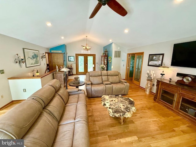 778 Overton Dr, Mineral, VA 23117 - living area with vaulted ceiling, light wood finished floors, ceiling fan, baseboards, and a chandelier