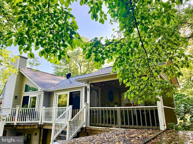 778 Overton Dr, Mineral, VA 23117 - view of front of house with a chimney, a wooden deck, and a shingled roof