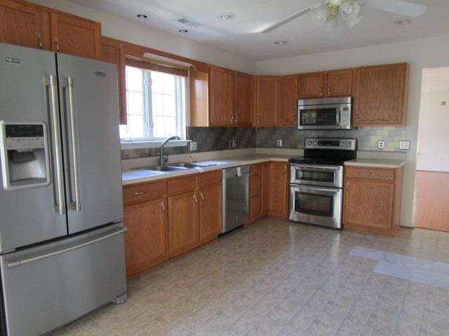 384 Hickory Grove Cir, Harrisonburg, VA 22801 - kitchen featuring appliances with stainless steel finishes, a sink, light countertops, and ceiling fan