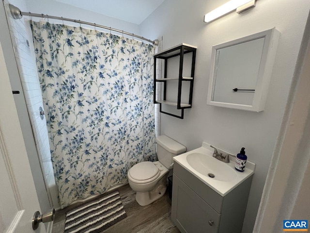 301 7th St SW, Charlottesville, VA 22903 - full bathroom featuring toilet, vanity, shower / bath combo, and wood finished floors
