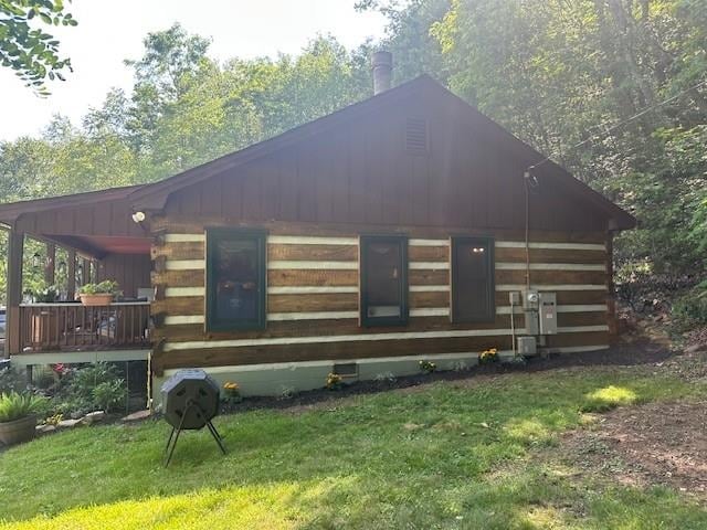 1063 High Valley Dr, Monterey, VA 24465 - view of property exterior featuring a lawn, log siding, and covered porch