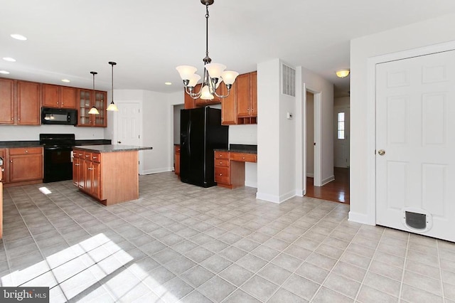 kitchen with light tile patterned flooring, black appliances, recessed lighting, a kitchen island, and dark countertops
