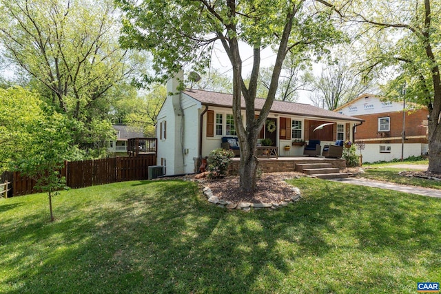 single story home with a chimney and central AC