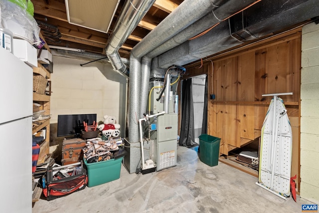 unfinished below grade area with concrete block wall and heating unit
