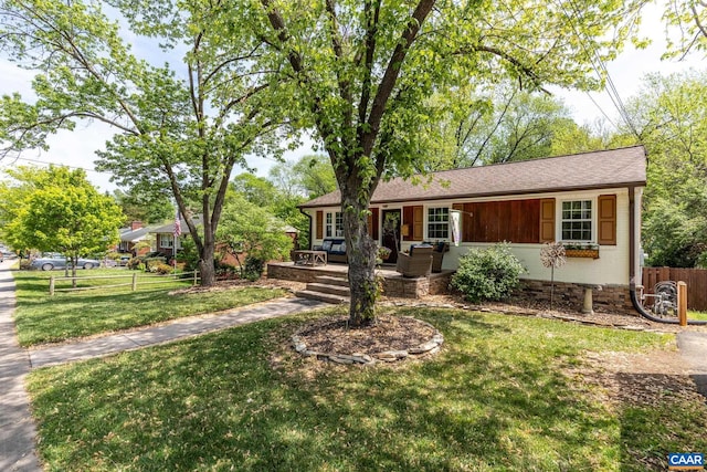 single story home with an outdoor hangout area and a shingled roof