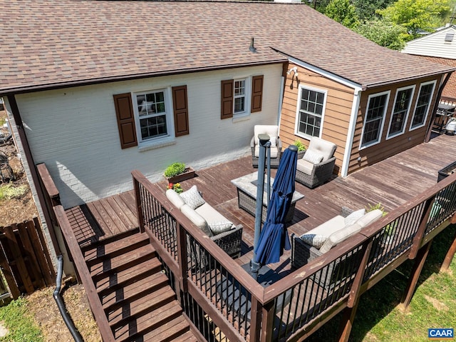 wooden terrace featuring stairway and an outdoor living space