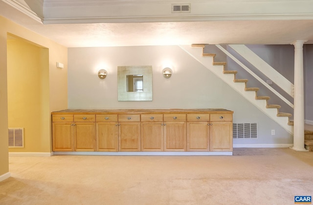 below grade area featuring visible vents and light colored carpet