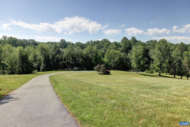 exterior space featuring a forest view