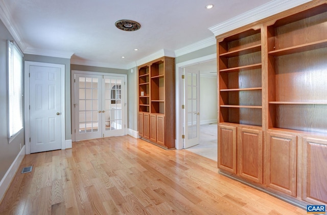interior space featuring visible vents, french doors, baseboards, and ornamental molding