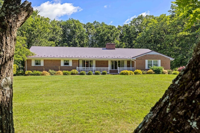 192 Sandy Ridge Rd, Waynesboro, VA 22801 - ranch-style house featuring covered porch, a chimney, brick siding, a front yard, and a metal roof