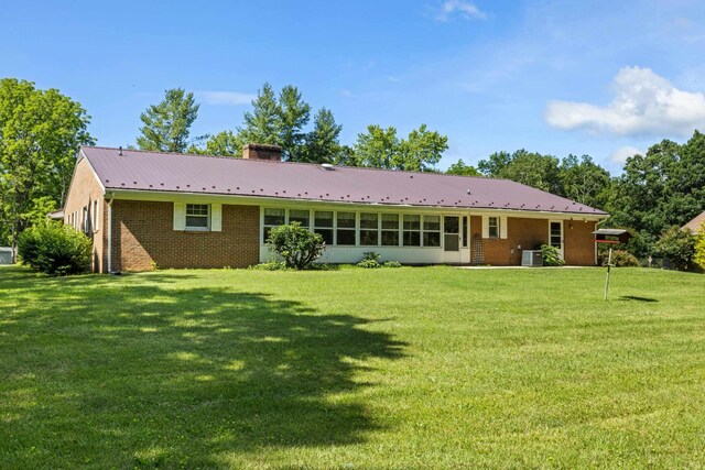 192 Sandy Ridge Rd, Waynesboro, VA 22801 - back of property featuring a chimney, a lawn, and brick siding