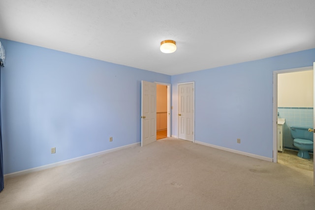 192 Sandy Ridge Rd, Waynesboro, VA 22801 - unfurnished bedroom featuring light colored carpet and ensuite bathroom