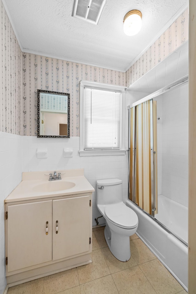 192 Sandy Ridge Rd, Waynesboro, VA 22801 - bathroom featuring vanity, shower / bath combination with glass door, a wainscoted wall, a textured ceiling, and wallpapered walls
