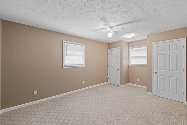 192 Sandy Ridge Rd, Waynesboro, VA 22801 - unfurnished bedroom with carpet floors, a ceiling fan, and a textured ceiling