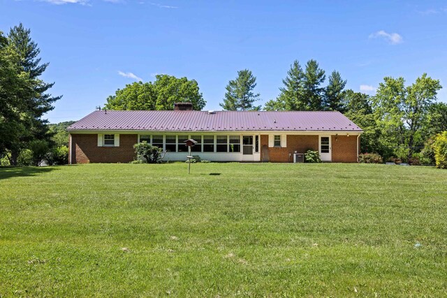 192 Sandy Ridge Rd, Waynesboro, VA 22801 - rear view of property with a chimney, brick siding, and a lawn
