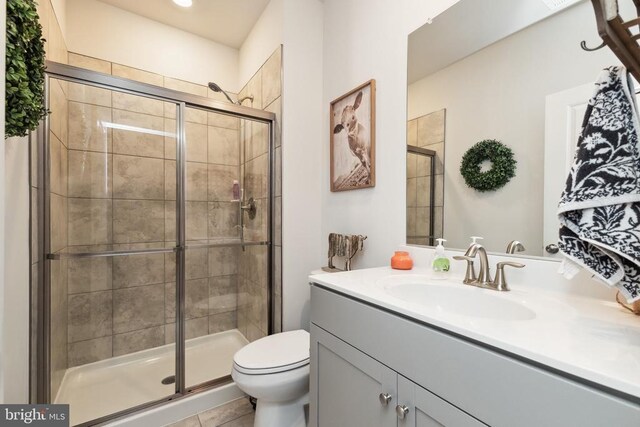 2089 Whithorn Hl, Jeffersonton, VA 22724 - full bathroom featuring toilet, vanity, a stall shower, and tile patterned flooring