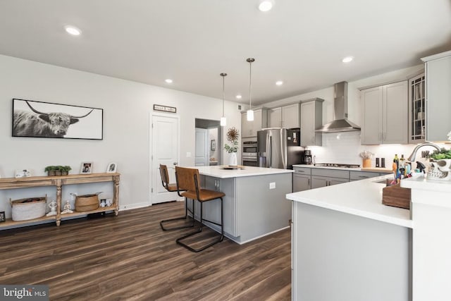2089 Whithorn Hl, Jeffersonton, VA 22724 - kitchen with wall chimney range hood, gray cabinets, stainless steel fridge with ice dispenser, gas stovetop, and a kitchen island