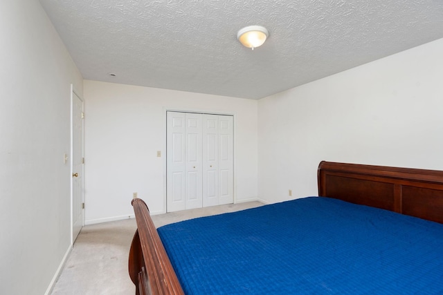 49 Bridgeport Dr, Waynesboro, VA 22980 - bedroom with light colored carpet, a textured ceiling, baseboards, and a closet