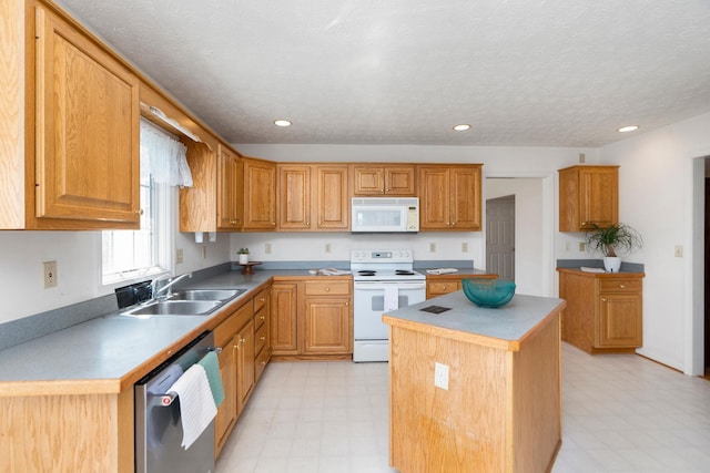 49 Bridgeport Dr, Waynesboro, VA 22980 - kitchen with white appliances, light floors, a sink, a kitchen island, and recessed lighting
