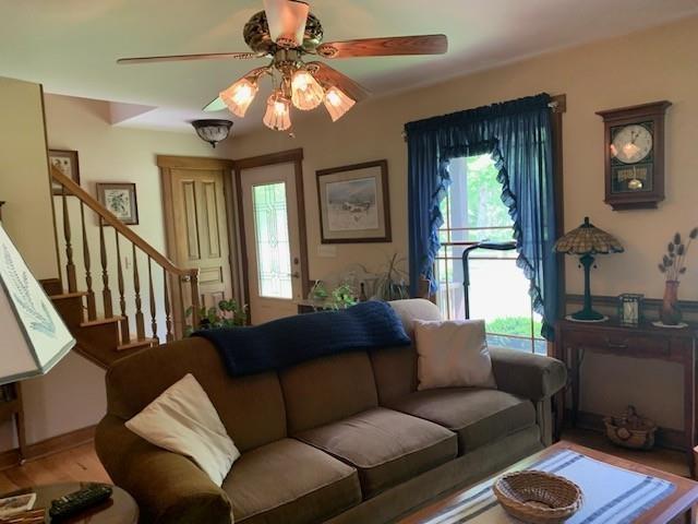 625 Hummingbird Ln, Monterey, VA 24465 - living room featuring a ceiling fan, stairs, and wood finished floors
