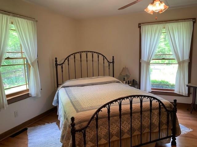 625 Hummingbird Ln, Monterey, VA 24465 - bedroom with wood finished floors, baseboards, and ceiling fan