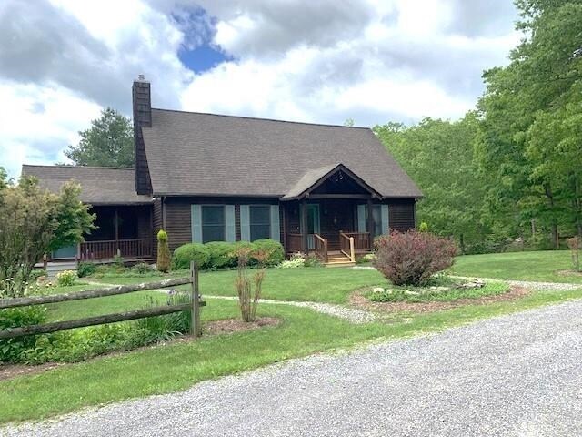 625 Hummingbird Ln, Monterey, VA 24465 - view of front of house featuring a chimney, a front lawn, and covered porch