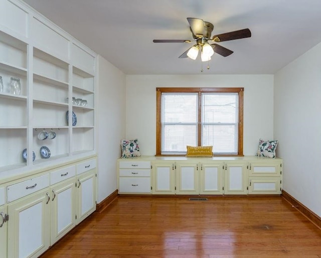 interior space with ceiling fan and light wood-type flooring